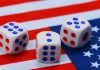 Patriotic dice on an American flag implying election betting