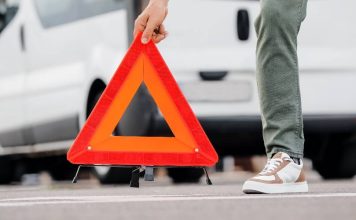 caution triangle being set on a road