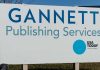 Gannett and US Today logos on a sign