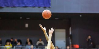 MGC aims to launch Massachusetts online betting March 10 Two arms tipping off a basketball