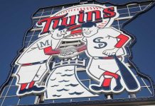 Sign of Minnesota Twins mascots shaking hands
