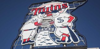 Sign of Minnesota Twins mascots shaking hands