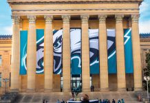 Large Philadelphia Eagles flag on a building