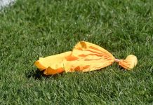Yellow penalty flag from football