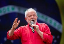 Entain Q4 update: President Lula in front of Brazil flag.