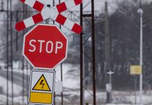 Railroad tracks stop sign