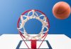 shot under a basketball rim with a ball mid-air