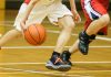 Feet of basketball player dribbling the ball
