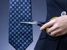 Scissors cutting a necktie