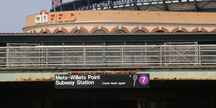 Citi Field with a Willets Point subway stop sign in the foreground
