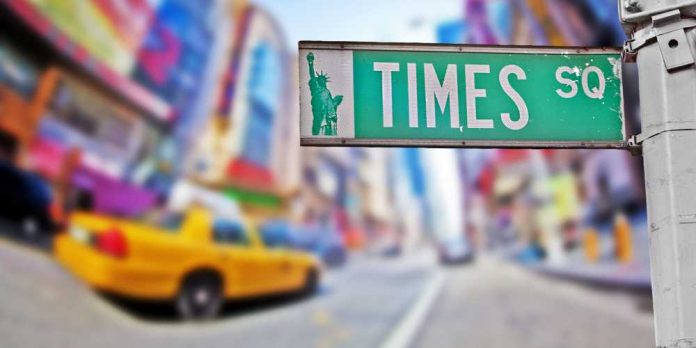 Times Square street sign with city in the background