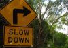 Yellow slow down road sign