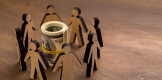 Prophet Exchange secures $10M in latest funding round Stick figures surrounded a rubber-banded roll of money