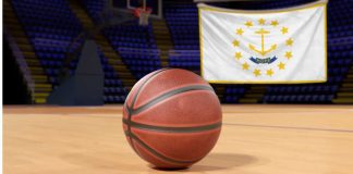 IGT to power Rhode Island sports betting through ’26 via contract extension Basketball on court in front of Rhode Island flag
