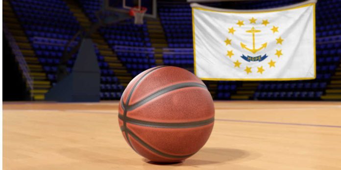 Basketball on court in front of Rhode Island flag