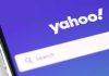 Yahoo logo on phone with purple background