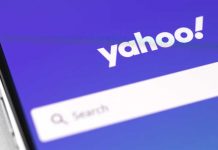Yahoo logo on phone with purple background