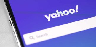 Yahoo logo on phone with purple background