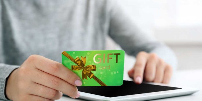 Hands holding a gift card