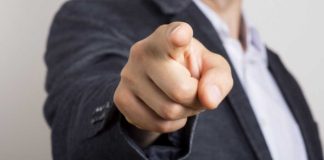 Finger pointing at camera