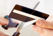 Scissors cutting a credit card