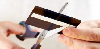 Scissors cutting a credit card