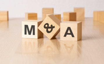 Wooden blocks with M&A written on it