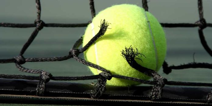 Tennis ball and broken tennis net