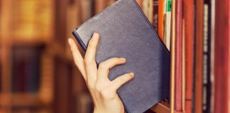 Bragg and FanDuel add new slot titles in Connecticut and Michigan Hand shelving a book