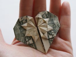 Heart made of money symbolizing charitable giving