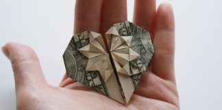 Heart made of money symbolizing charitable giving