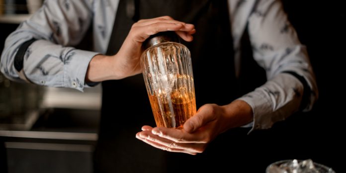 Bartender shaking cocktail