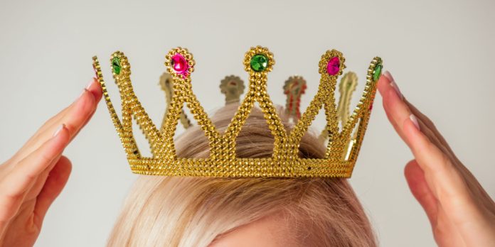 Woman putting on crown