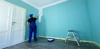 painter decorating walls