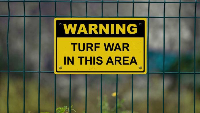 Turf war warning sign
