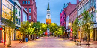 Image shows a street in Burlington, Vermont lit by street lights