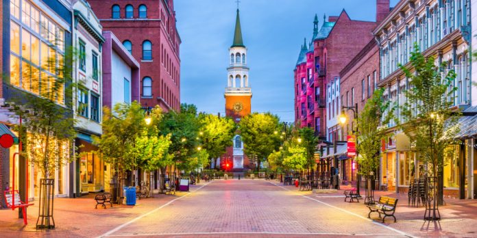Image shows a street in Burlington, Vermont lit by street lights
