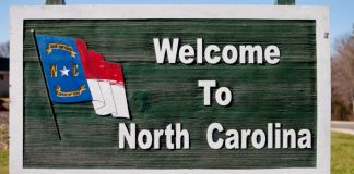 A road sign that reads welcome to North Carolina