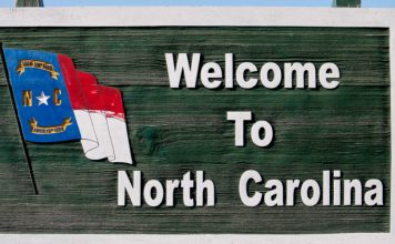 A road sign that reads welcome to North Carolina