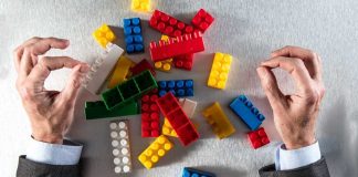 A person is sorting a pile of lego
