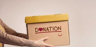 Hands holding donation box