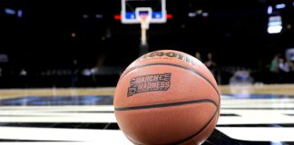 Simplebet readies for March Madness after record regular season betting Close up of a basketball with the march madness logo on a basketball court