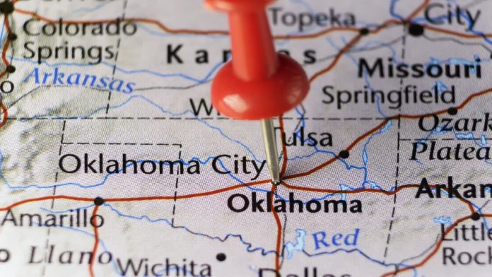 A map of Oklahoma with a pin in it