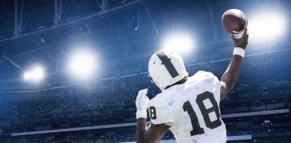 A quarterback passes a football