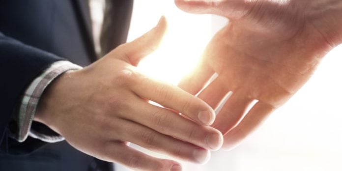 Close up of two people shaking hands