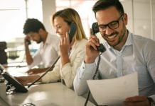 3 people making phone calls in an office