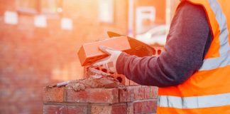 Person laying brick