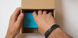 Hand unpacking a box