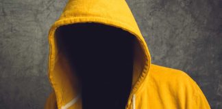Faceless person in hoodie