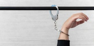 Appeals court upholds limits on Hermalyn’s role at Fanatics Hand handcuffed to rail
